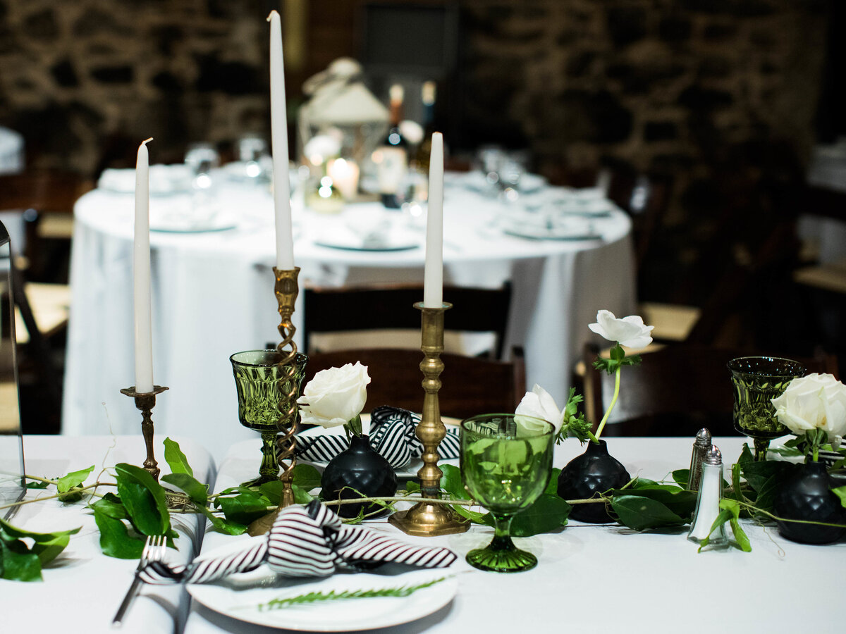 long head table decorated with greenery