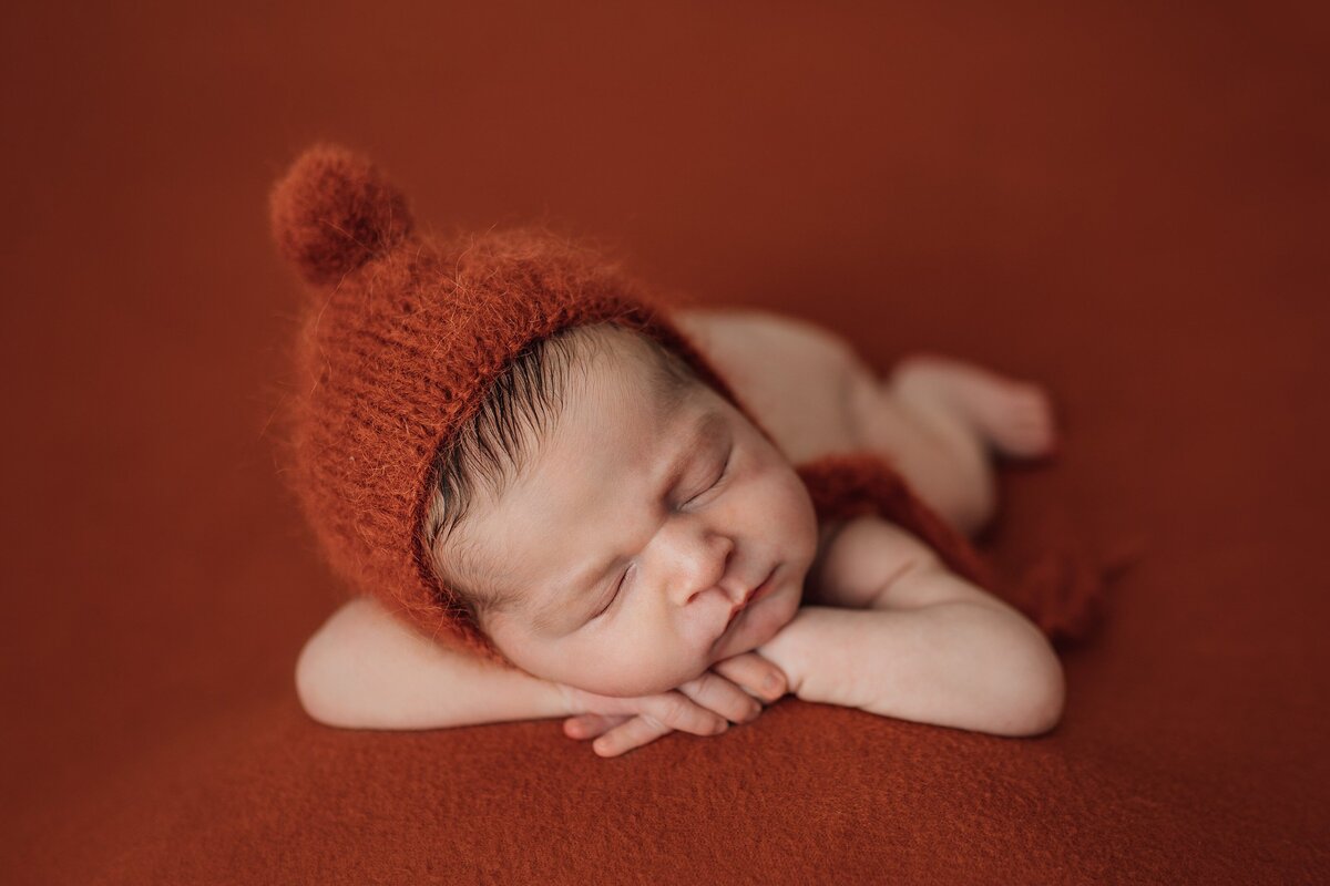 baby boy on rust in tampa newborn photography studio