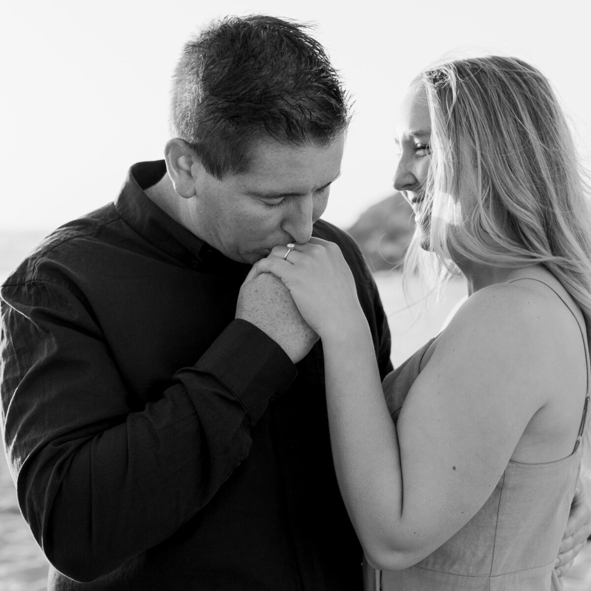 Kissing on the hand engagement picture