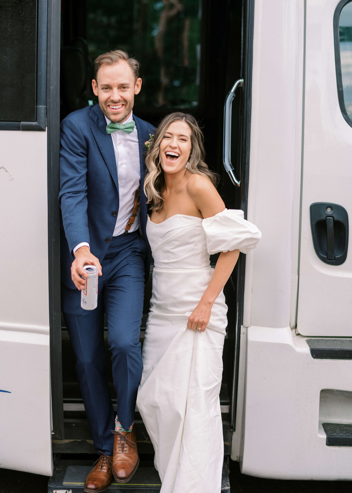 Virginia Wedding Photographer captures brunette groom and bride as they exit their party bus for their reception