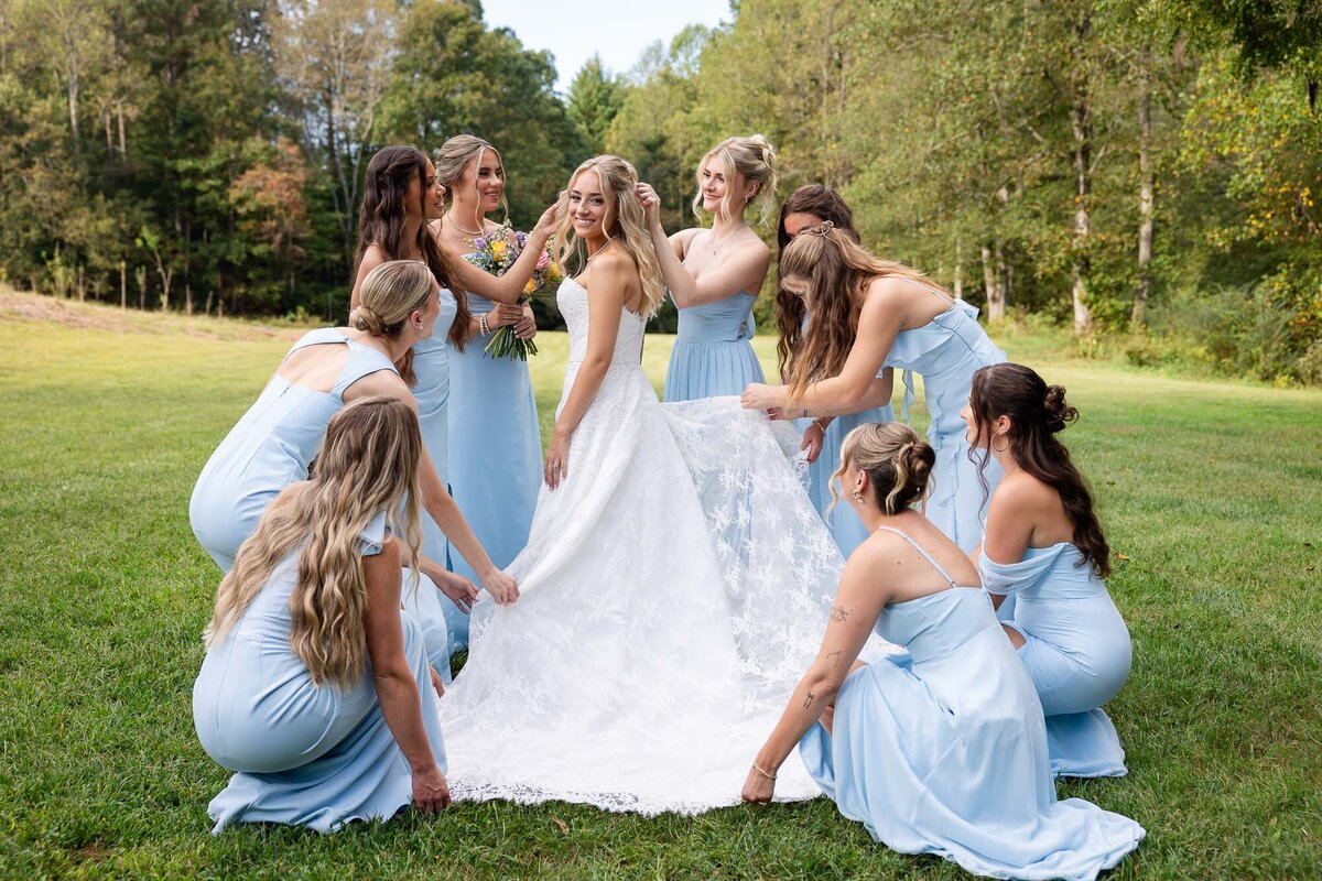 bridesmaid poses with bride during her wedding in north georgia 