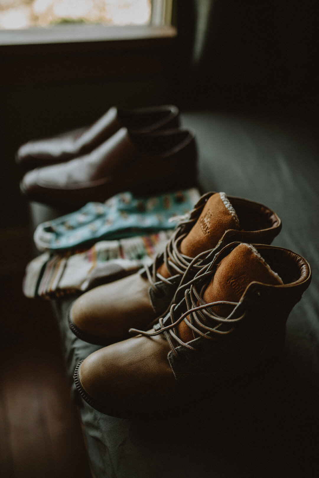 Hiking boots lined up in macro shot before elopement wedding day