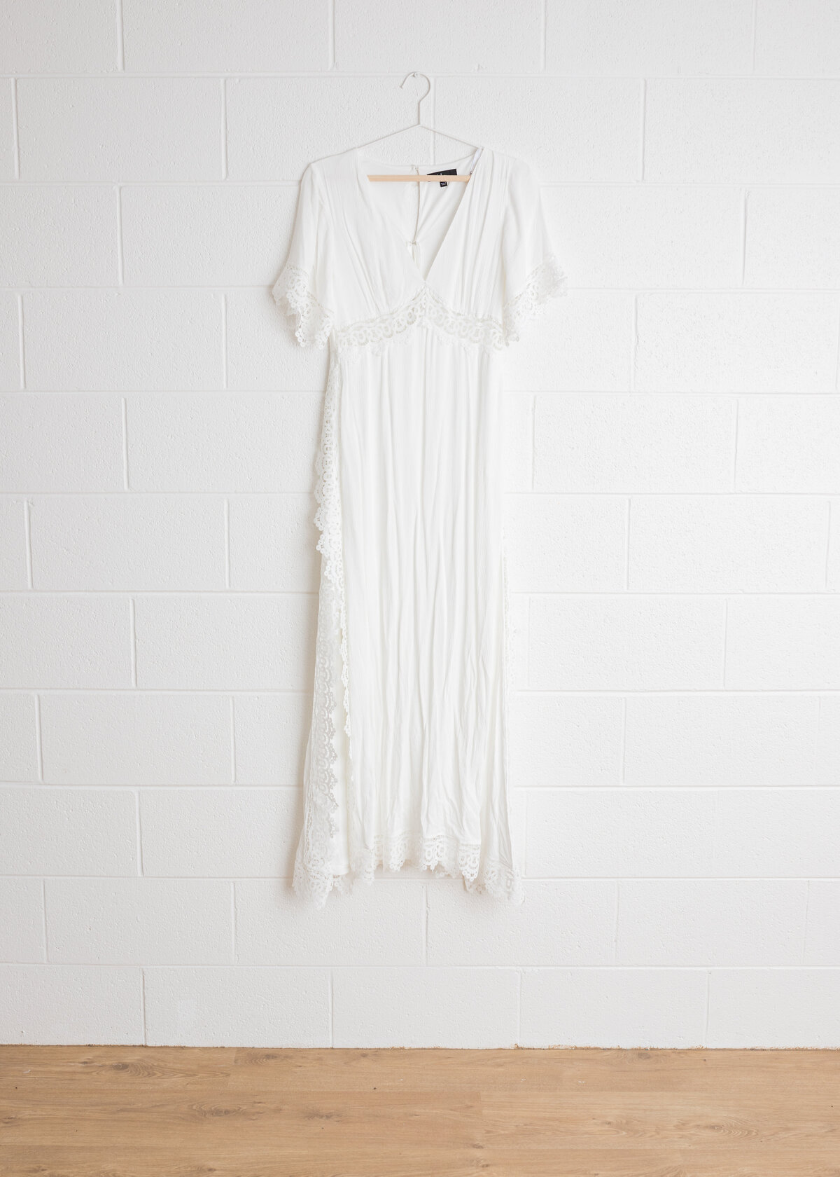 Lulu's Sweeten the Occasion Maxi Dress in White with lace trim, available in sies S - L in Lauren Vanier Photography's Hobart Studio Wardrobe