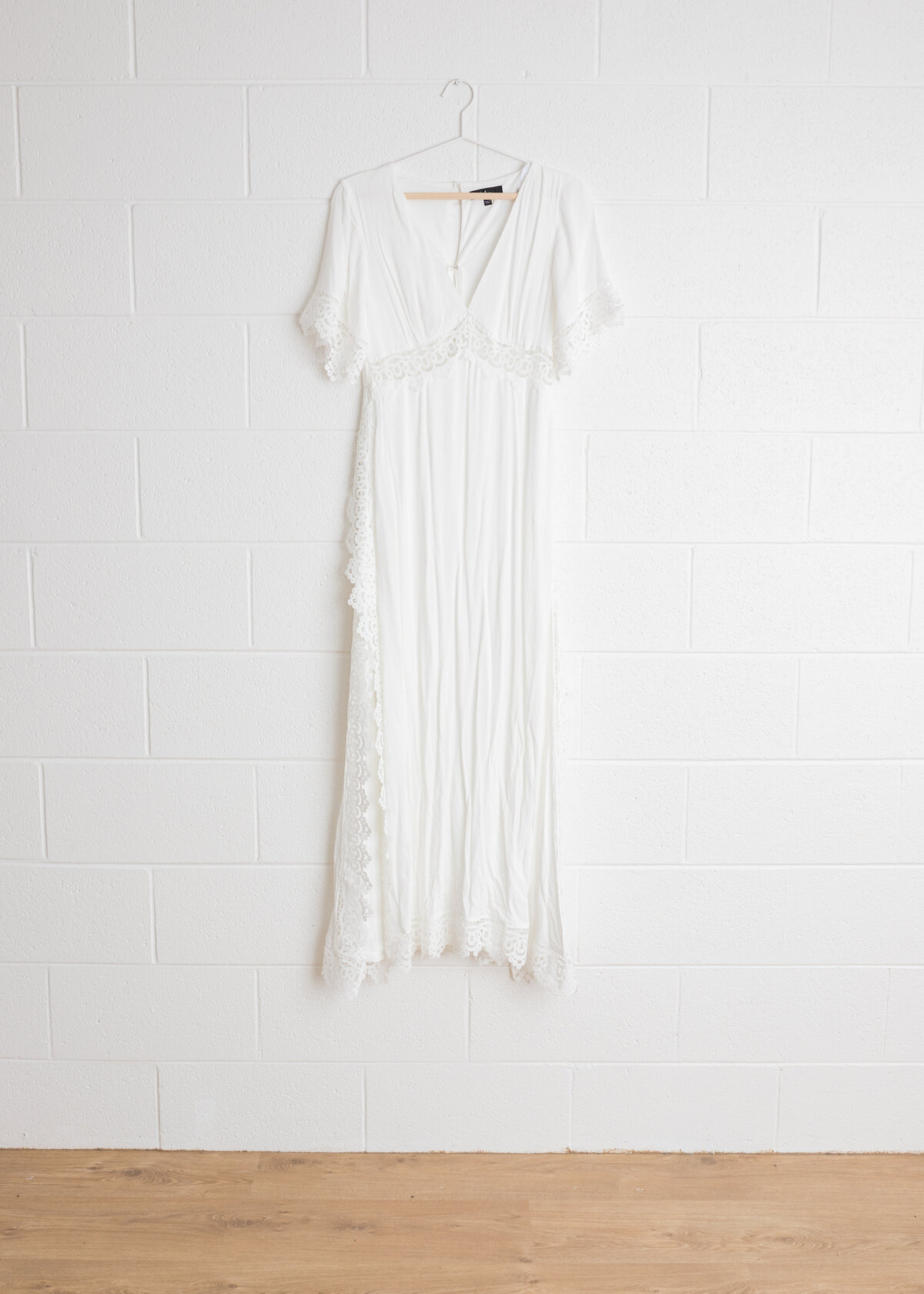 Lulu's Sweeten the Occasion Maxi Dress in White with lace trim, available in sies S - L in Lauren Vanier Photography's Hobart Studio Wardrobe