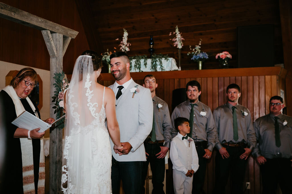 Bride and groom smiling at each other