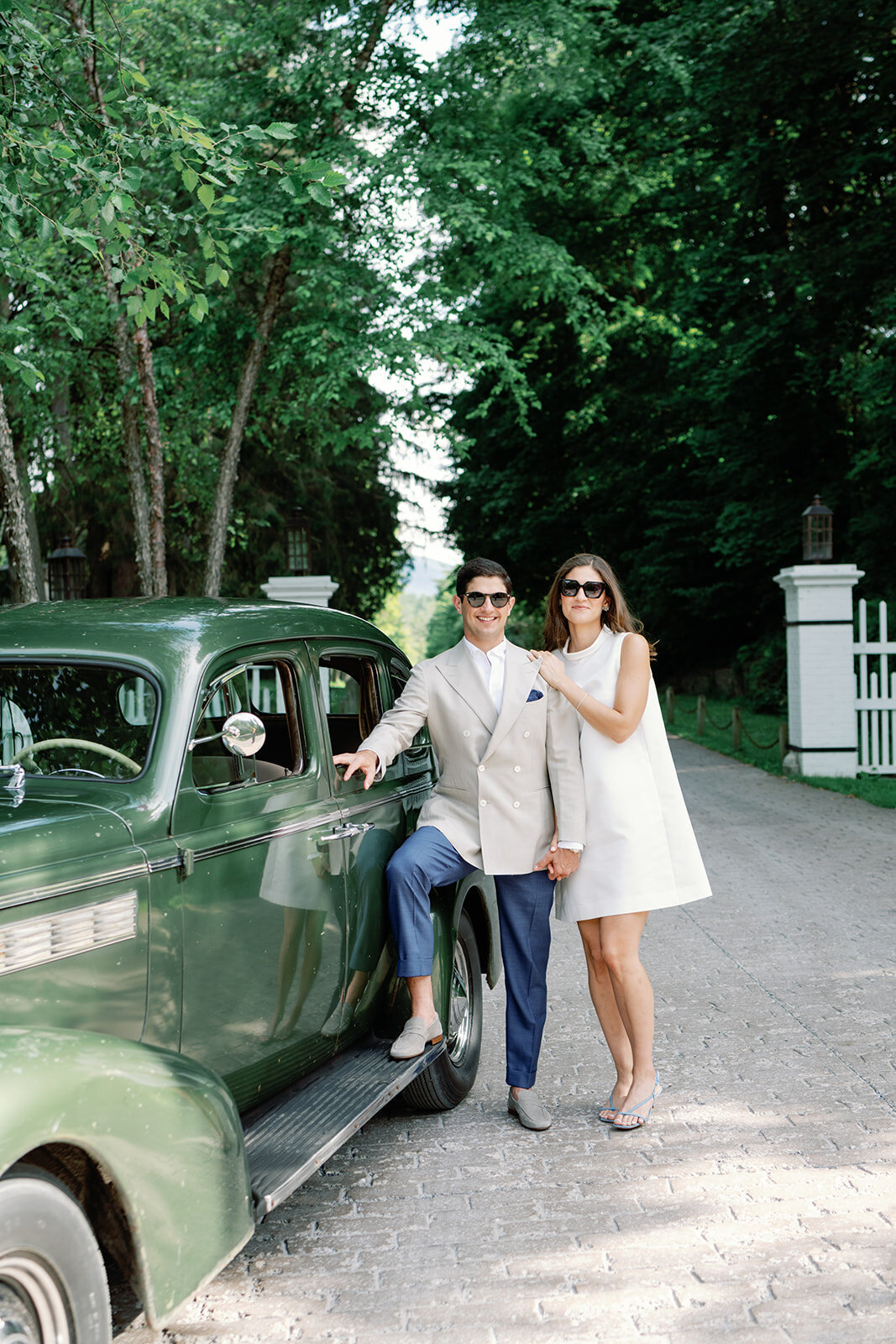 wedding couple pose in front of vintage car for hildene vermont wedding
