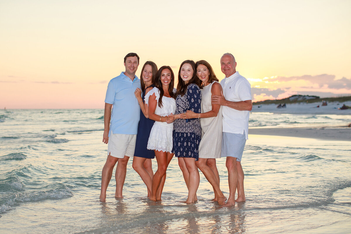 family portrait on beach at sunset