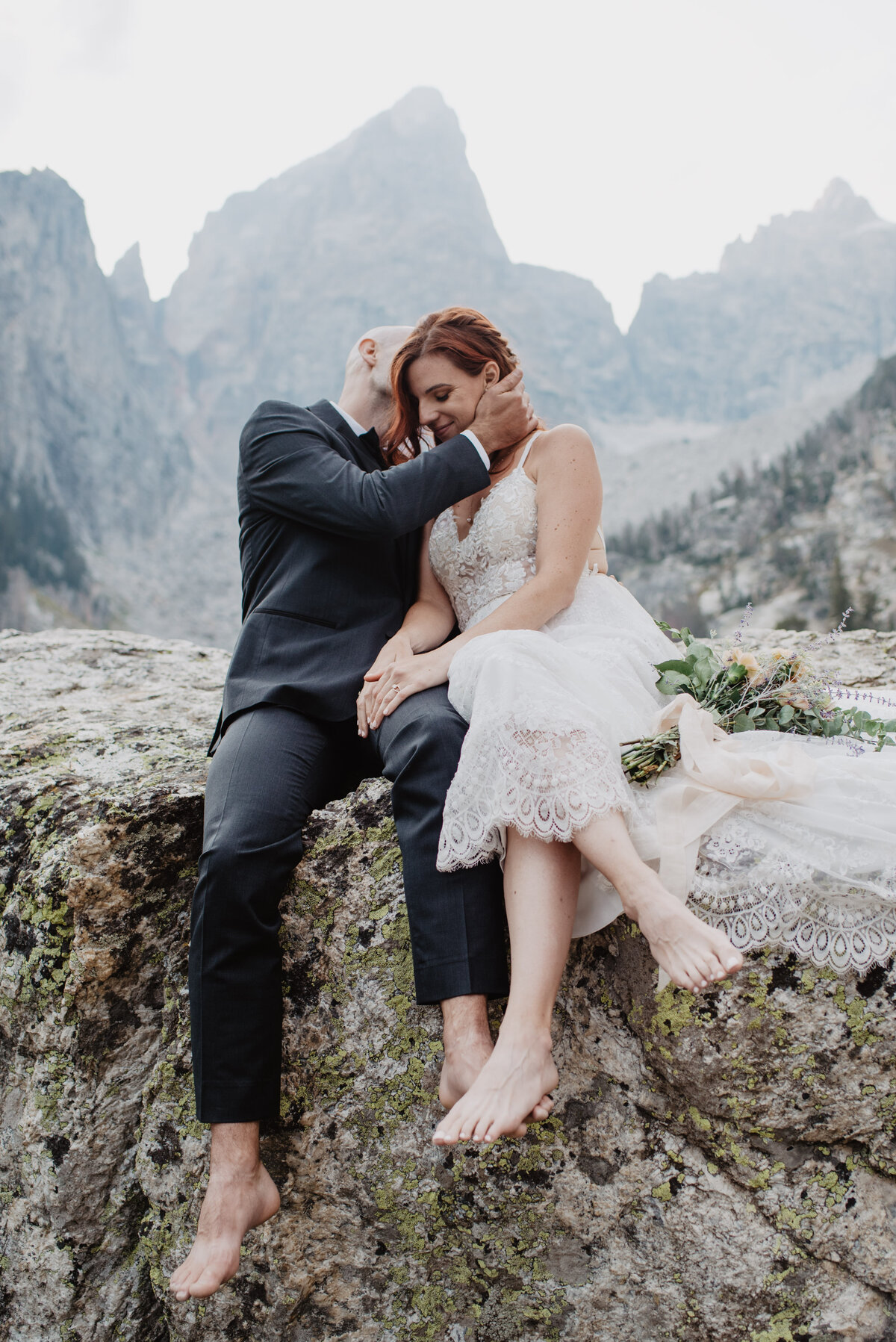Jackson Hole Photographers capture groom holding bride's head