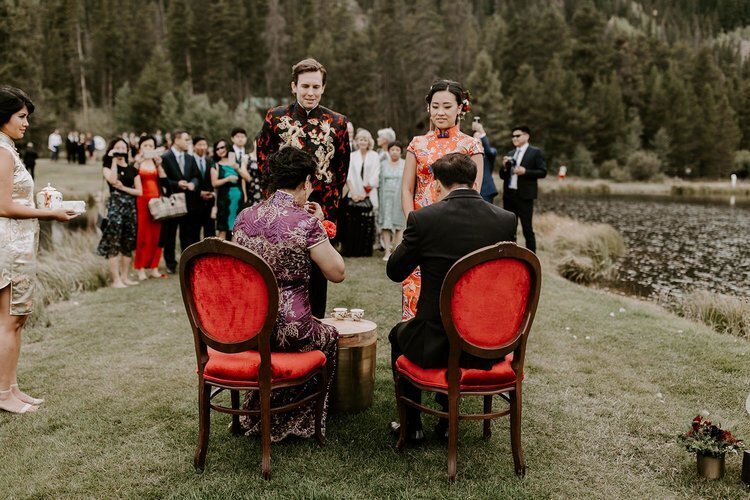 Outdoor red upholstered seating at a wedding in Colorado