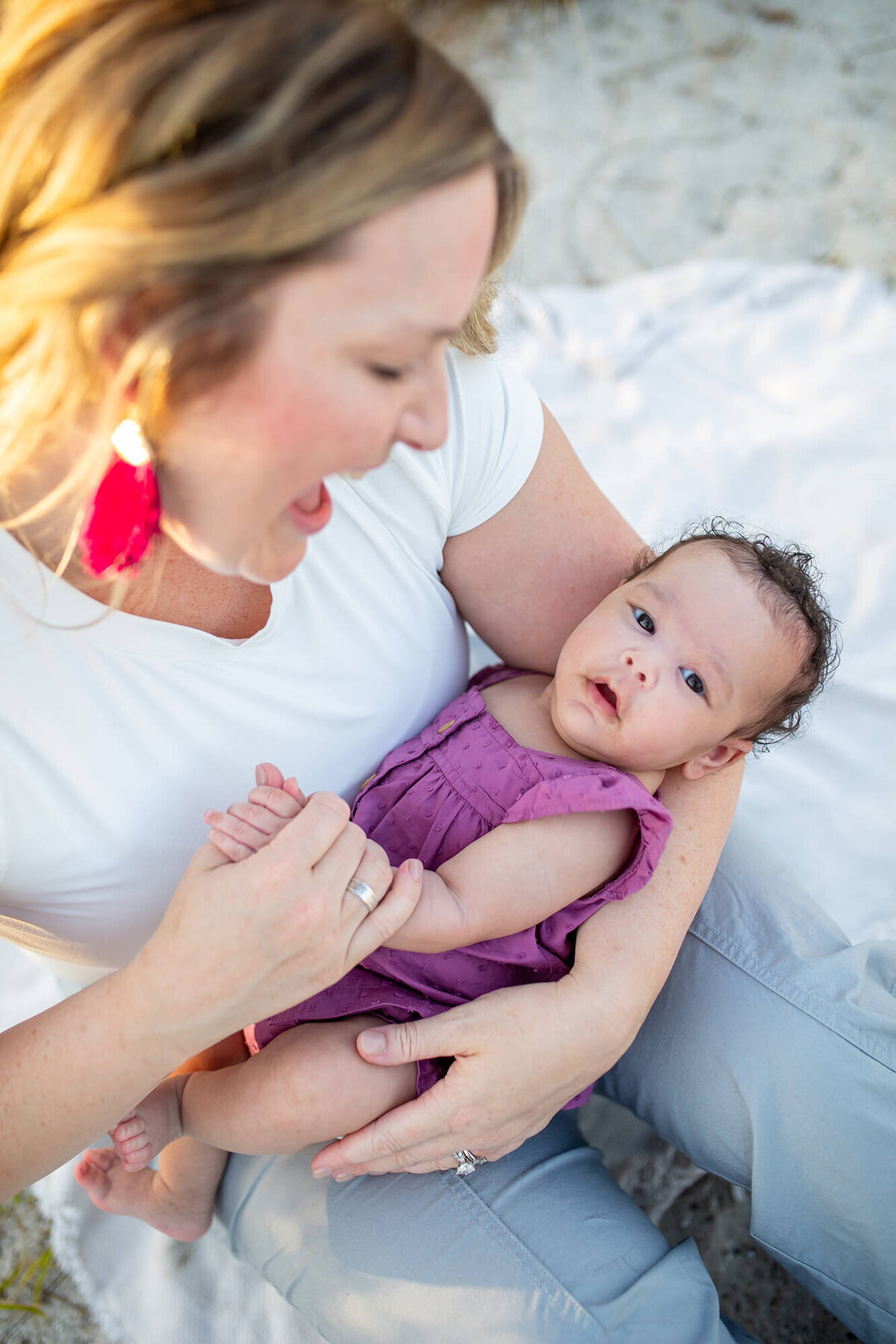 Mother looking down at baby while she looks up 