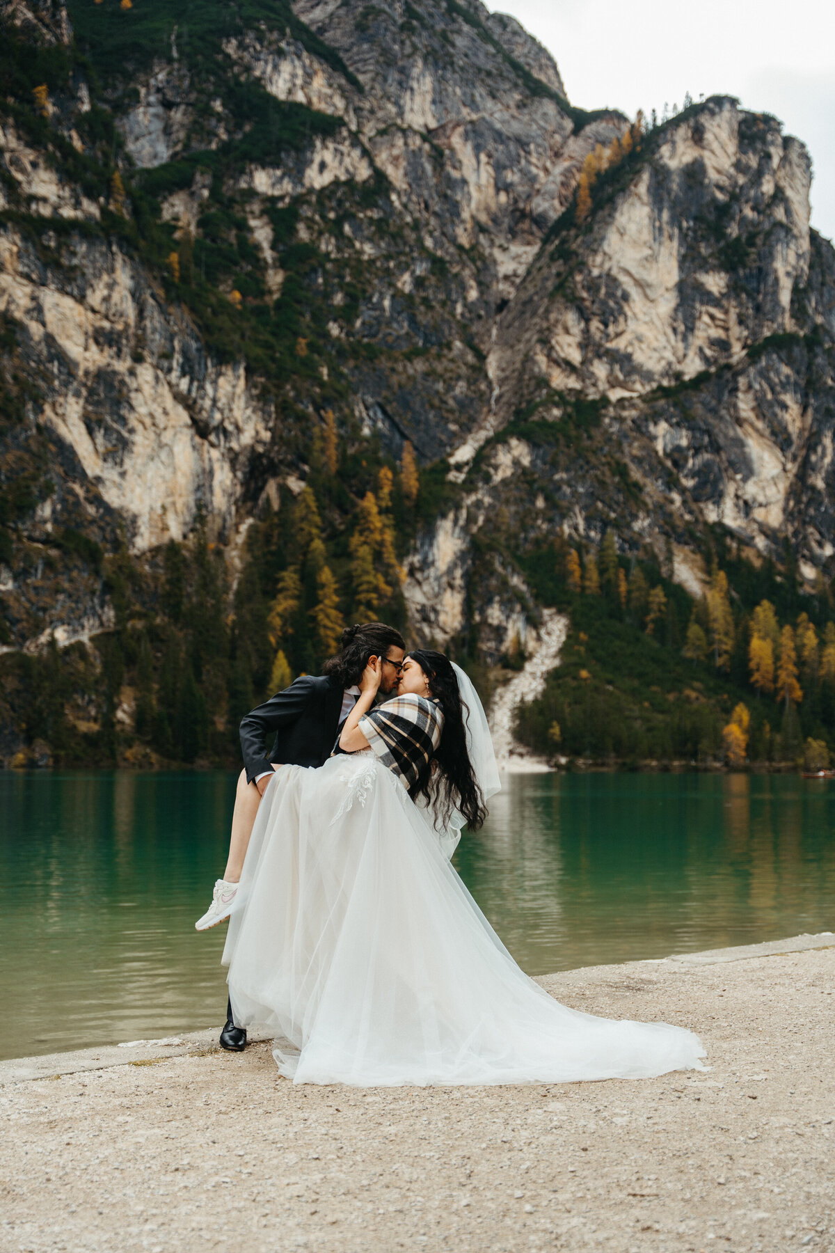 Couple kissing during intimate elopement in South Tyrol