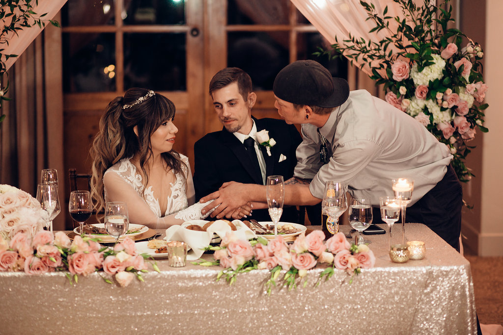 Wedding Photograph Of Man In White Long Sleeves Having a Handshake With Bride Los Angeles