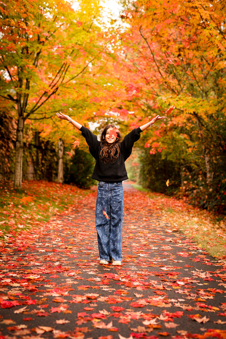 girl-throwing-leaves-marymoor-park-portrait