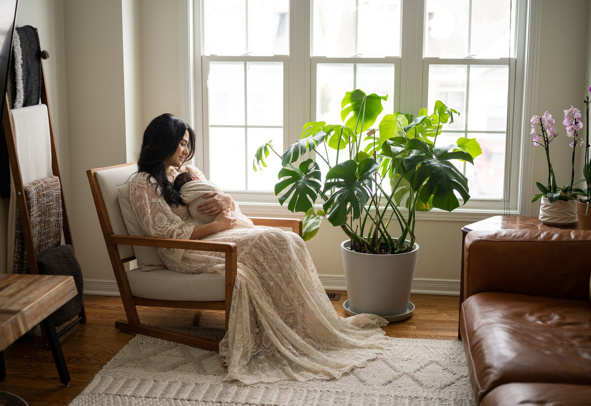 Mother sitting in her living room in Ottawa