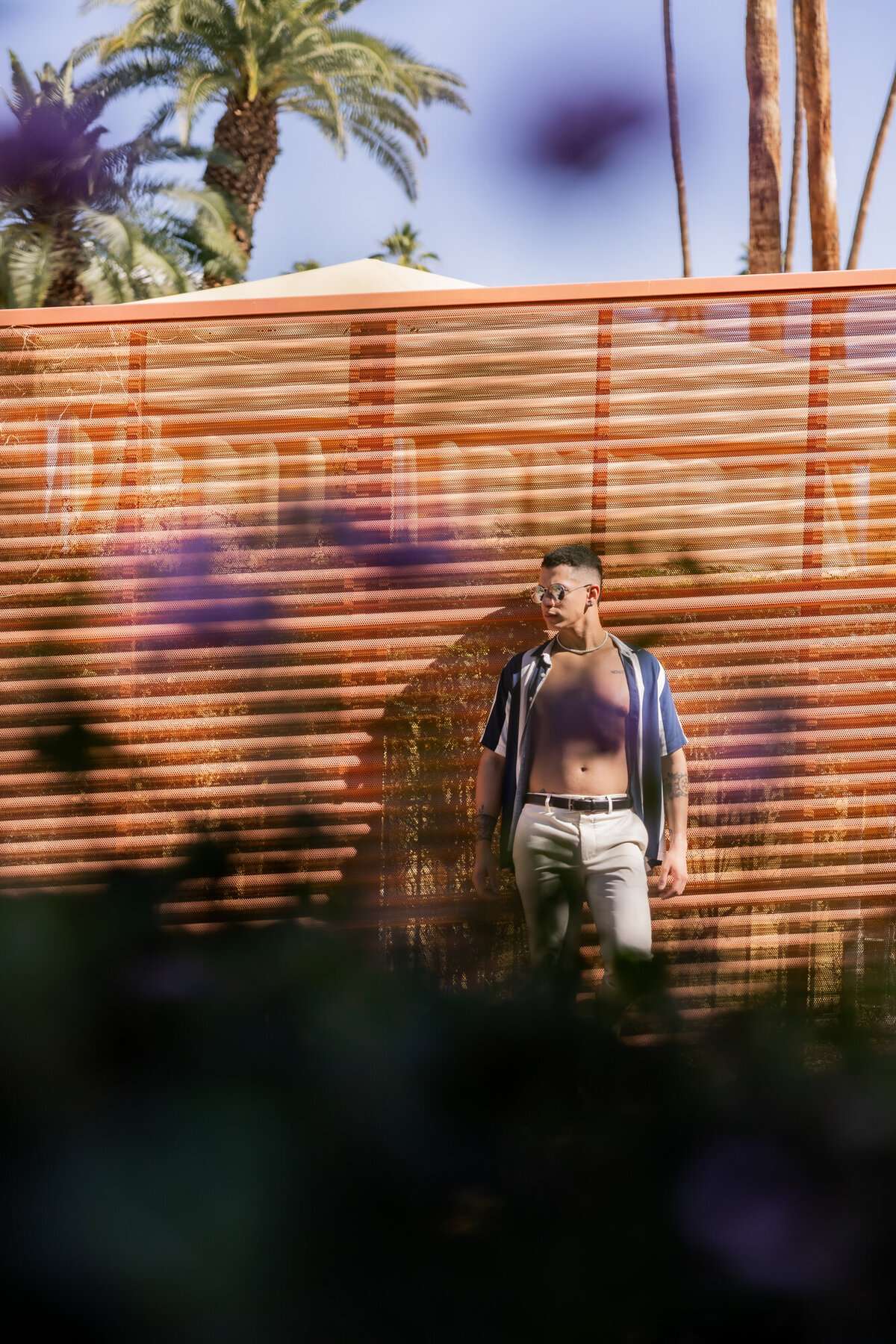 Fashion portrait with dynamic motion blur in a desert setting, styled for a bold, colorful branding look.