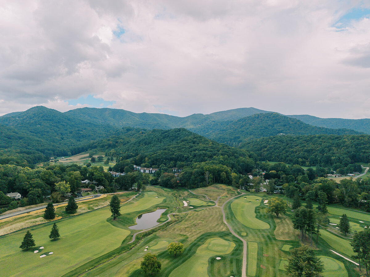Aerial drone view of The Waynesville Inn & Golf Club surrounded by Blue Ridge Mountains, an ideal destination wedding venue in Waynesville, North Carolina.