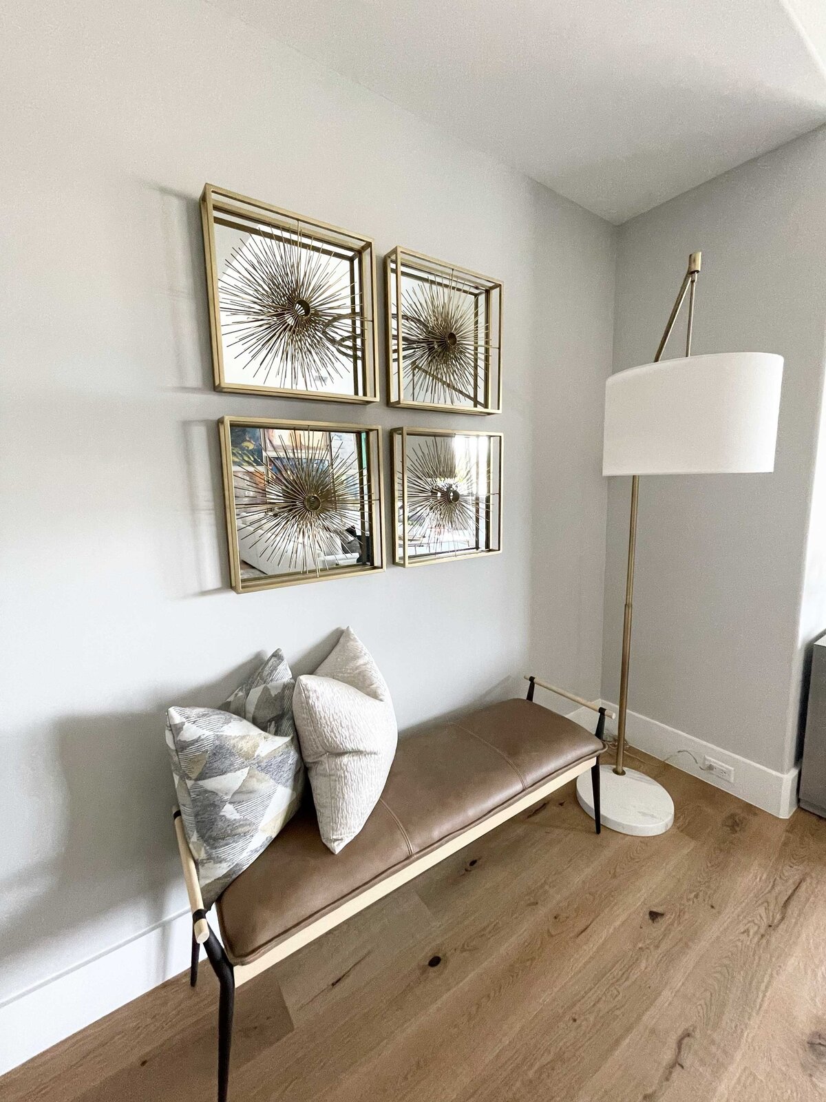 Transformative home interior design for the entrance featuring a pair of small chairs and tasteful artwork, enhancing the limited space with style and charm.