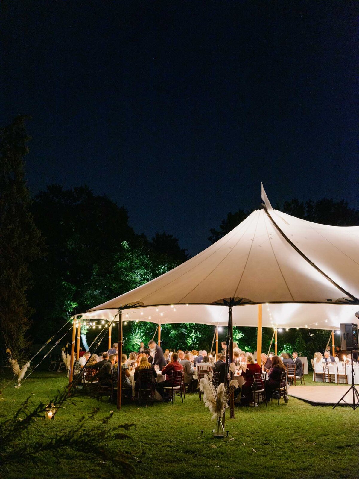 Elegant tented reception at private estate wedding.