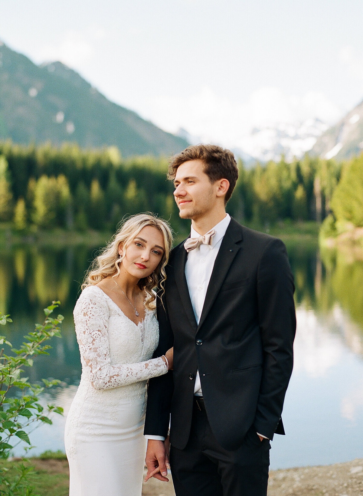 elopement photography poses in gold creek pond in washington state