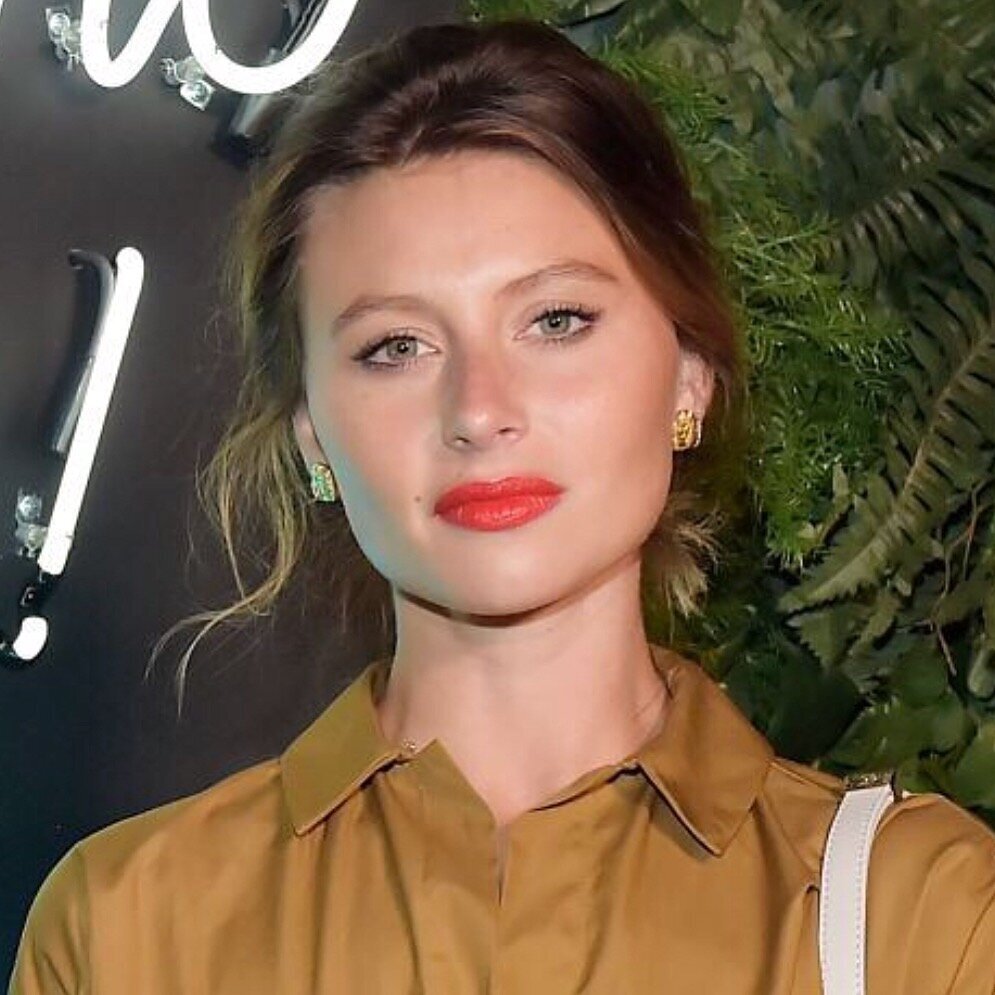 Aly Michalka in a red lip with her hair pulled back
