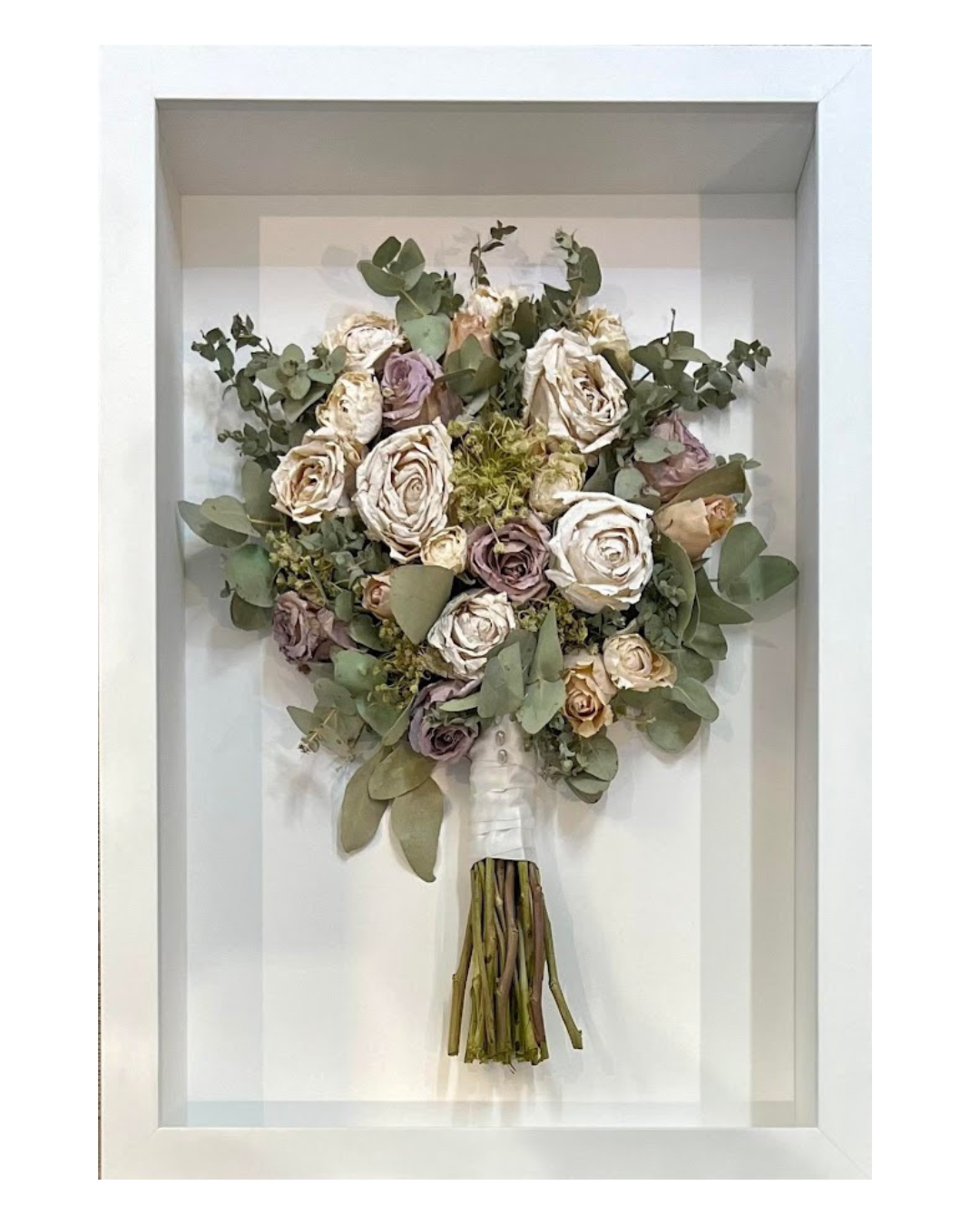 Wedding bouquet preserved in 3D frame.