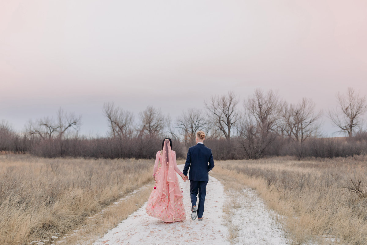 bride groom walking at sunset