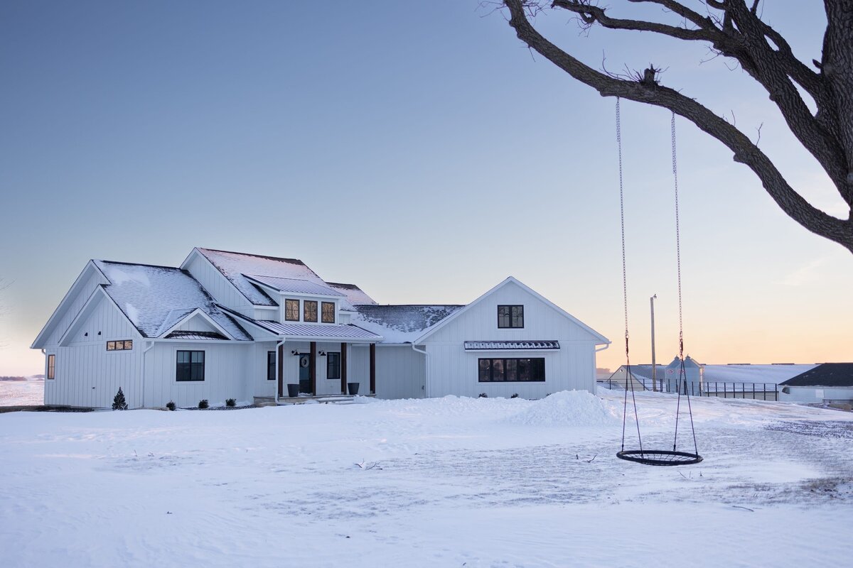 michele rosenboom design modern farmhouse front exterior house in the snow