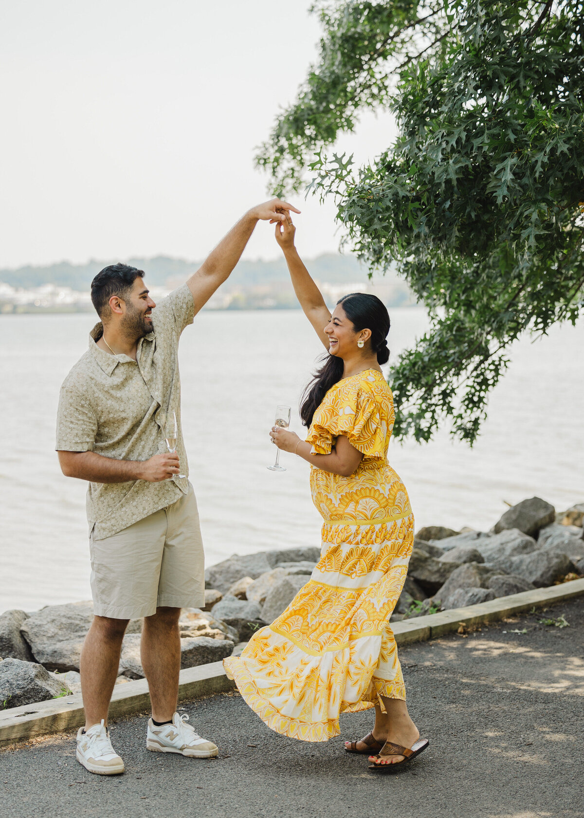 Two people twirl one another in Alexandria at their proposal.