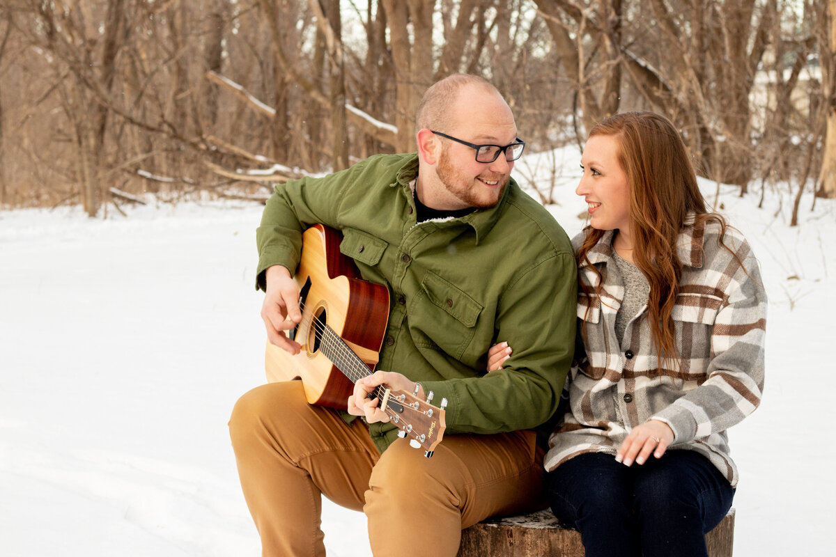 Couple's engagement photos in Michigan's winter season. Photo by Bay City Wedding Photographer.