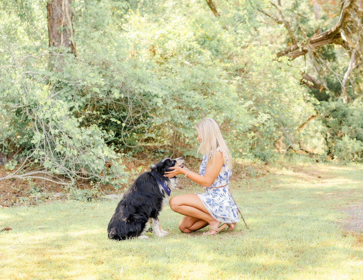 sweet moment when a girl and her dog are looking directly into each other's eyes