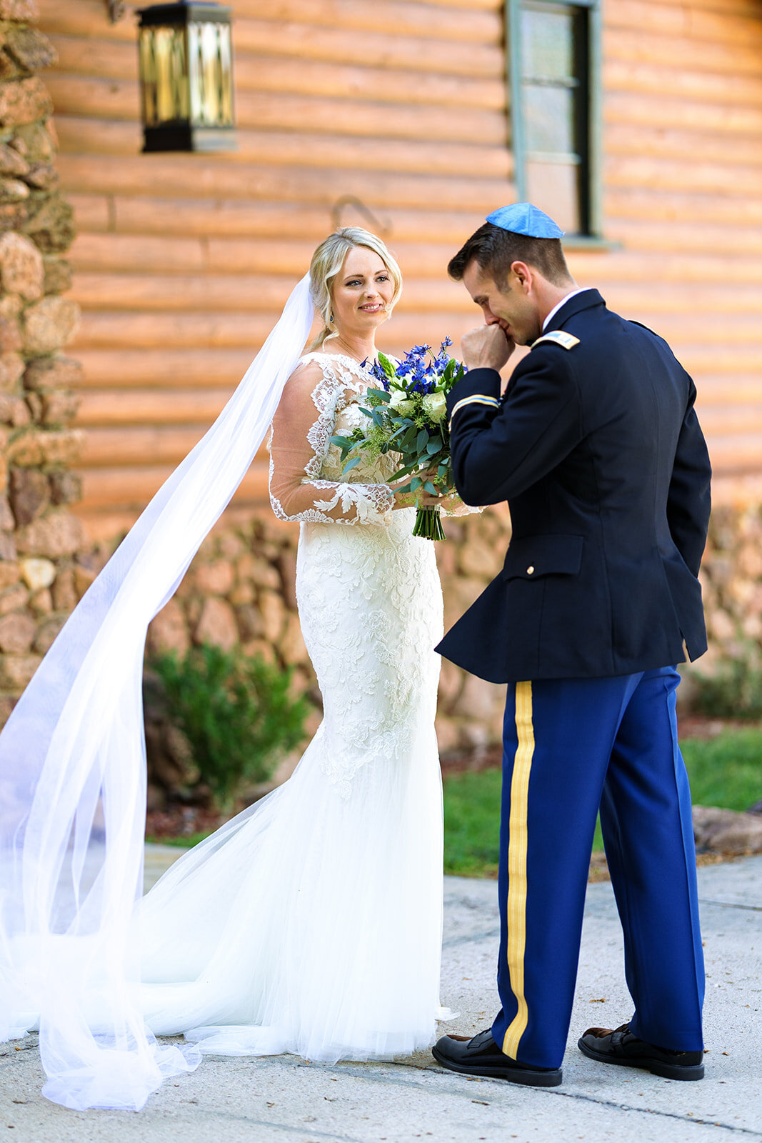 groom in military outfit has emotional reaction to seeing bride