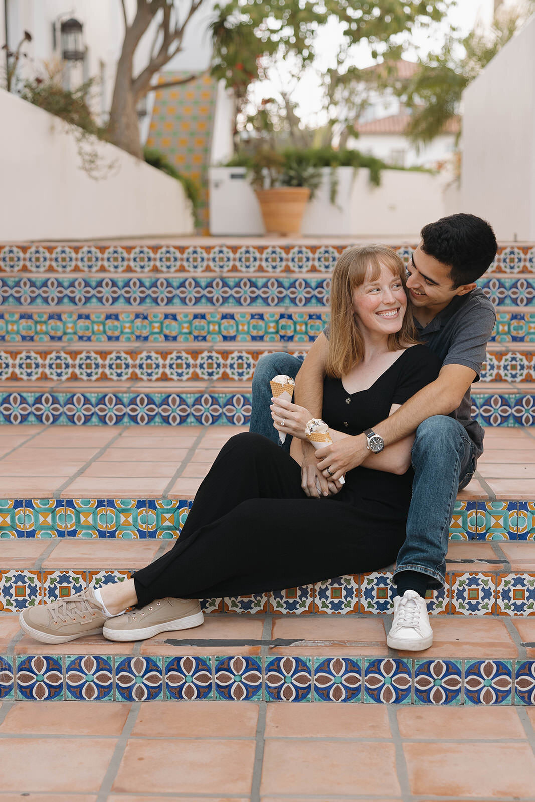 Couple sitting on colorful tiled steps