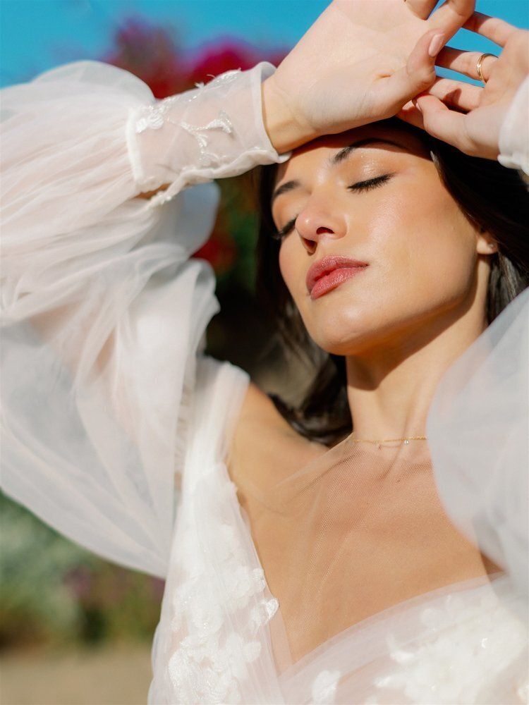 Bride in white tulle dress and natural, glowy makeup