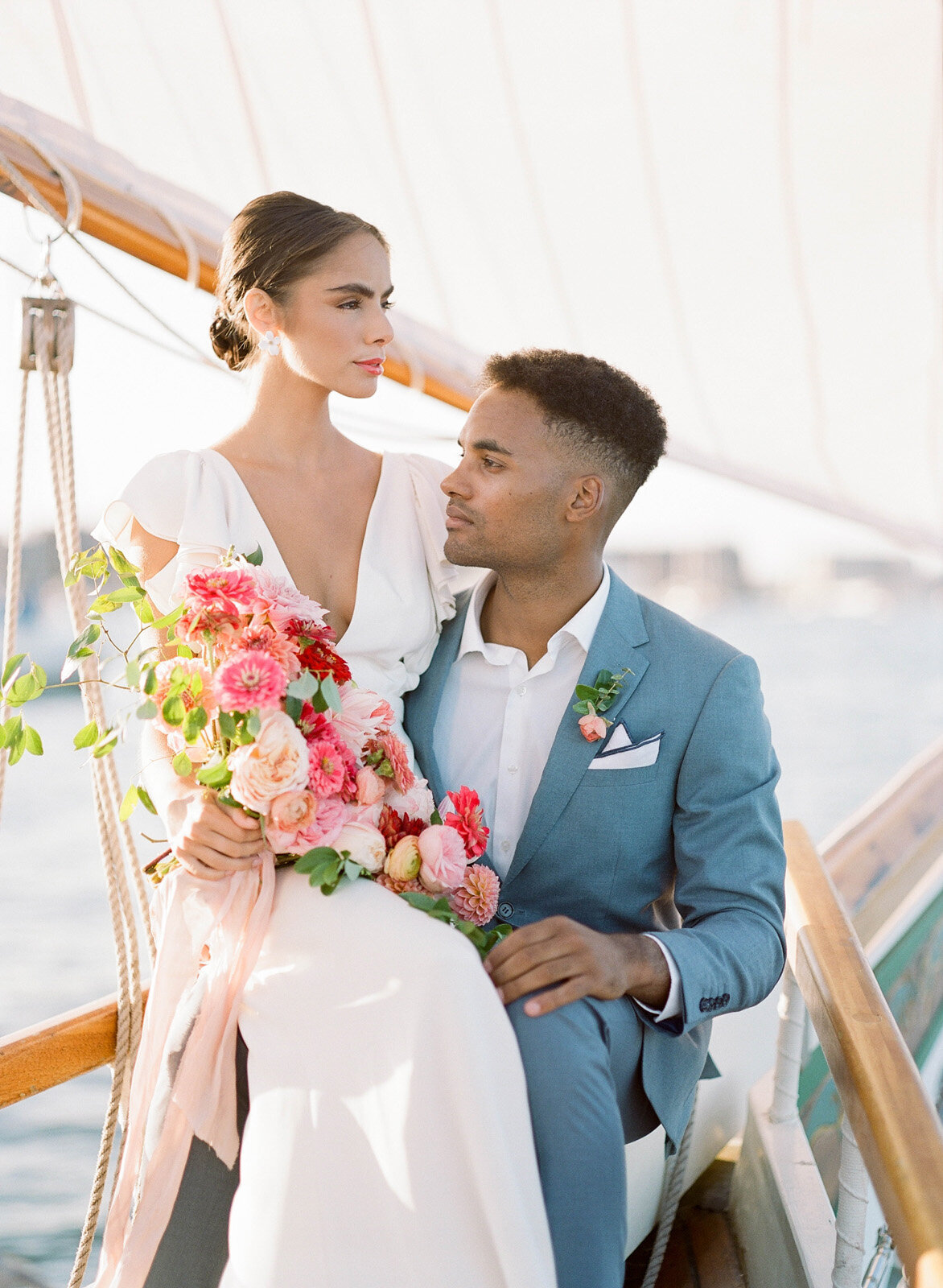 Kate-Murtaugh-Events-elopement-wedding-planner-Boston-Harbor-sailing-sail-boat-yacht-greenery-water-skyline-couple-bouquet
