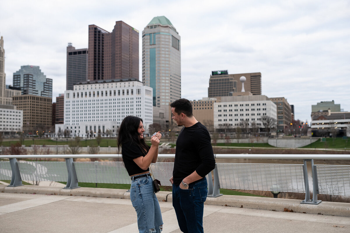 Newly engaged couple celebrating after proposal