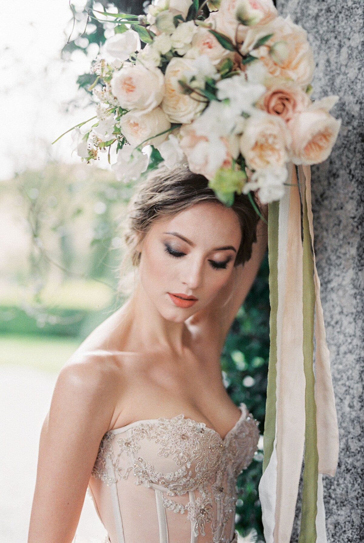 bride-holds-bouquet-flowers-her-head