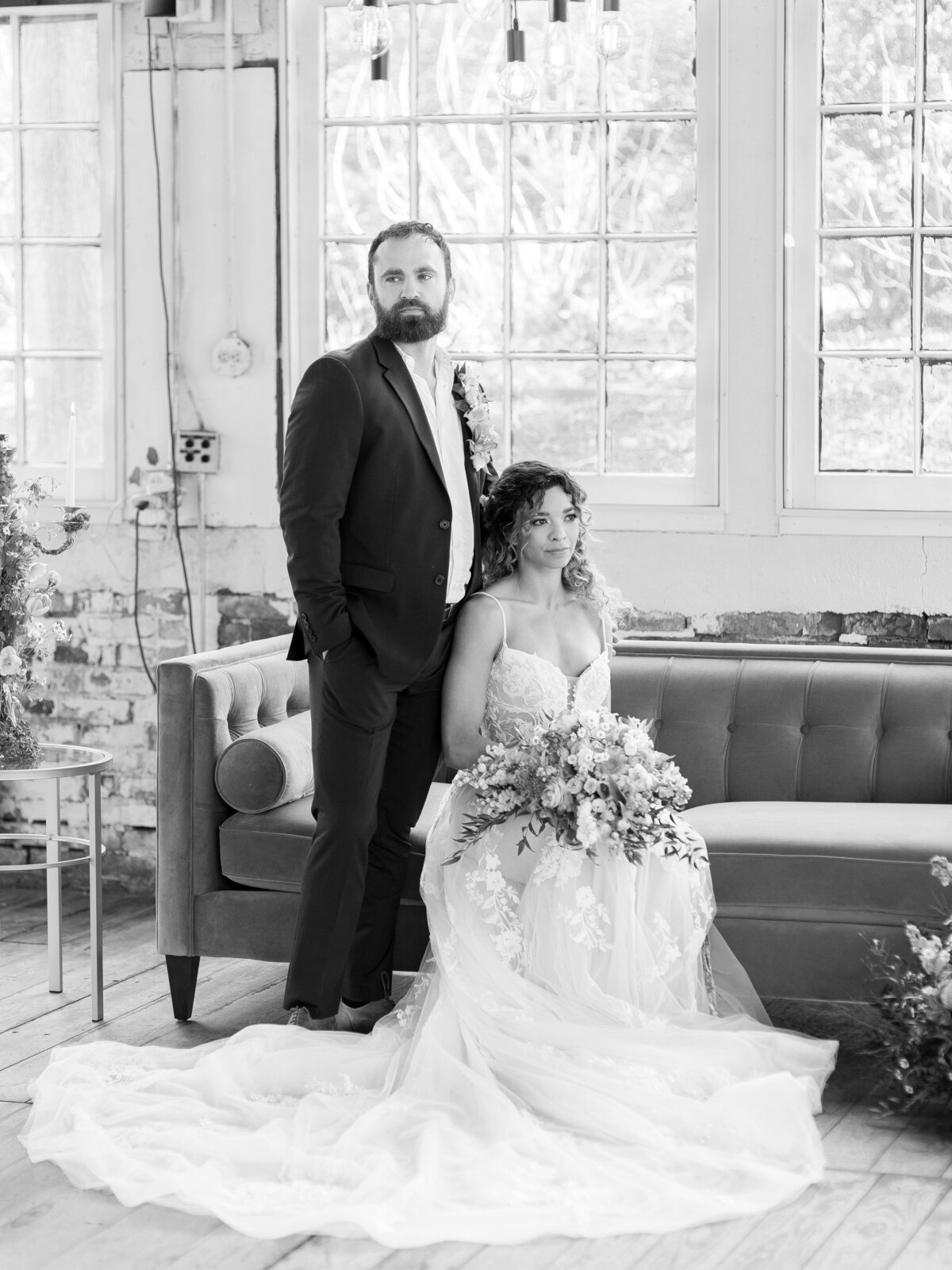 Bride sitting with groom behind her