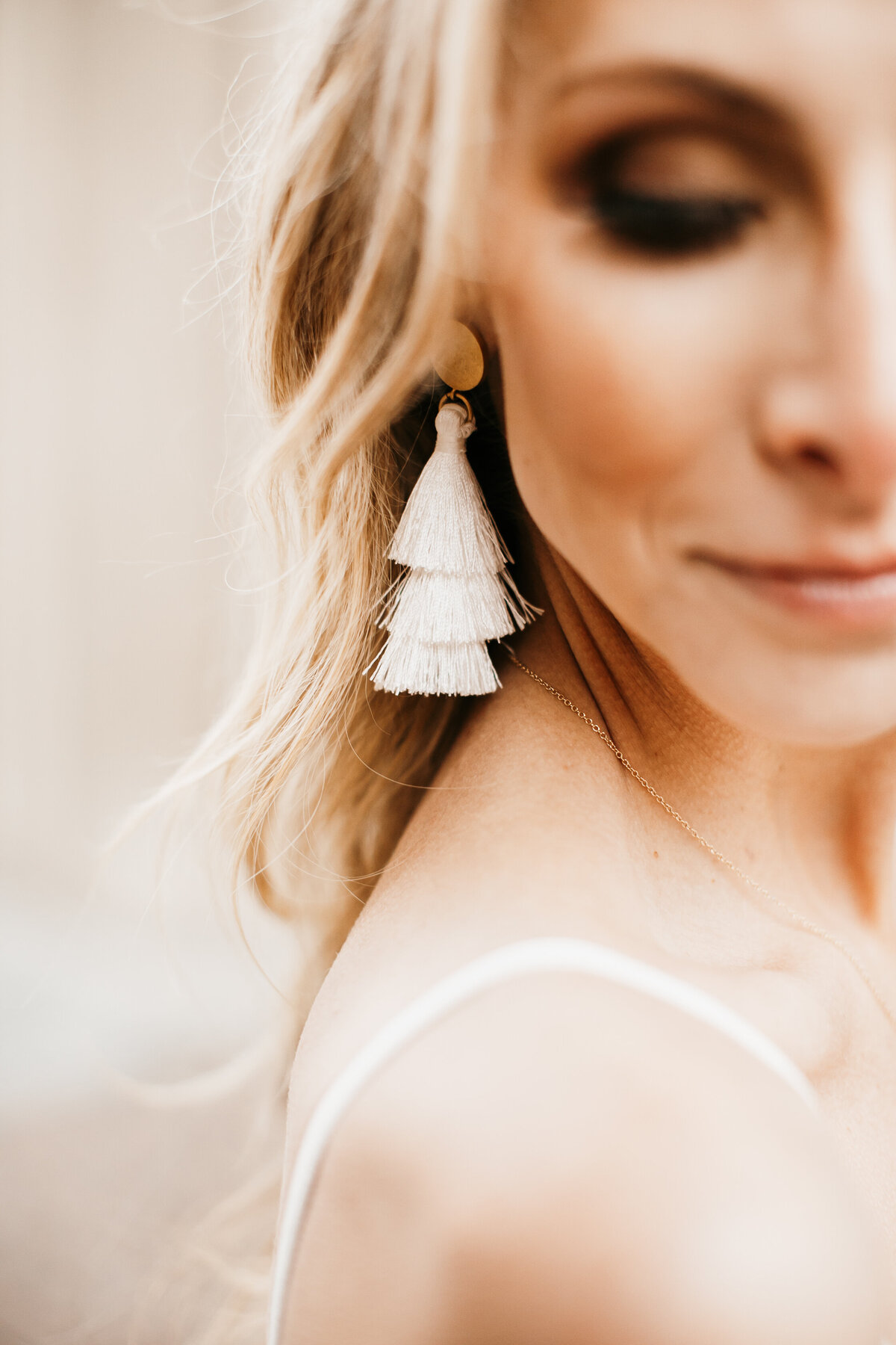 bridal portrait of earrings and accessories