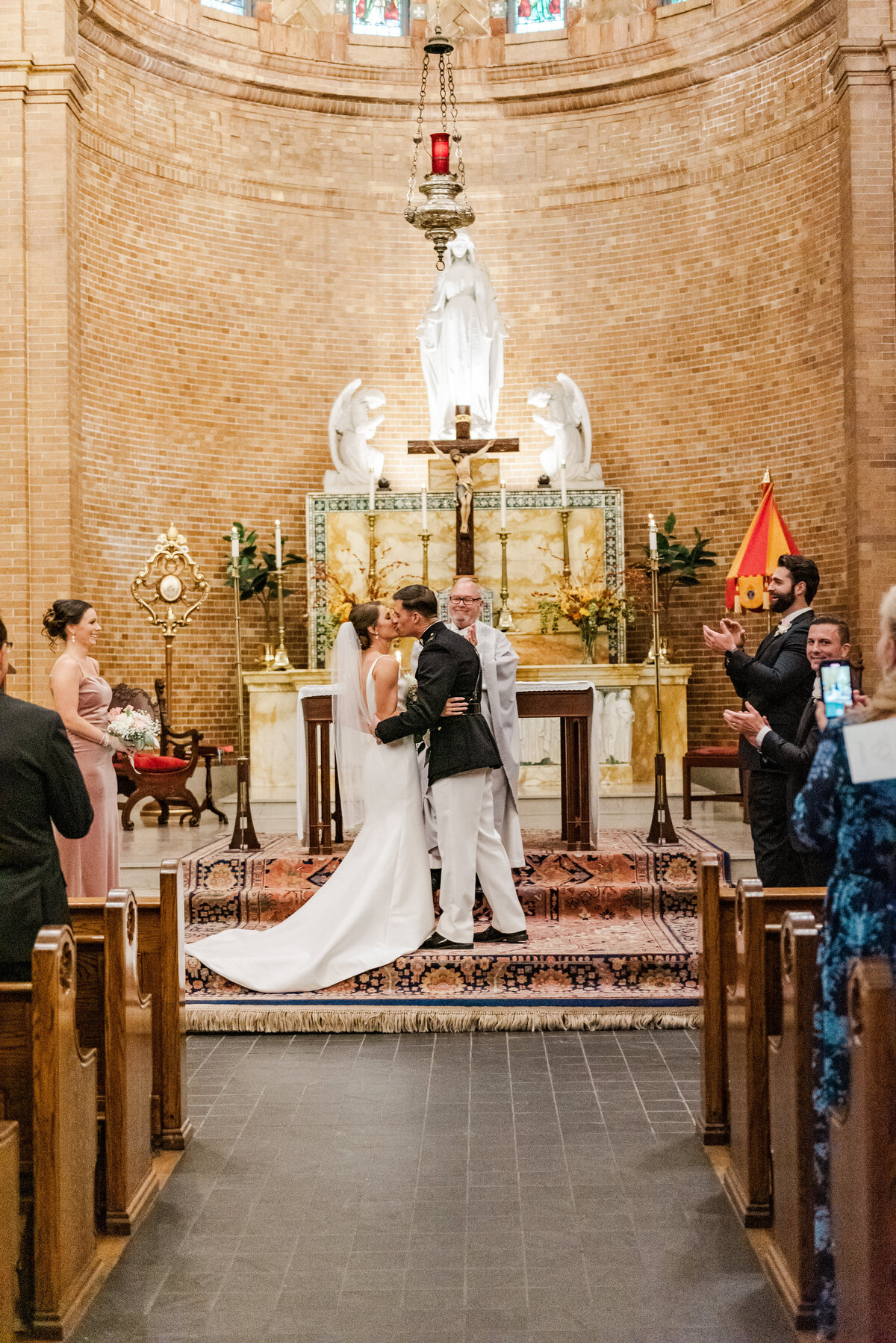bride and groom kissing at the alter in wilmington, nc