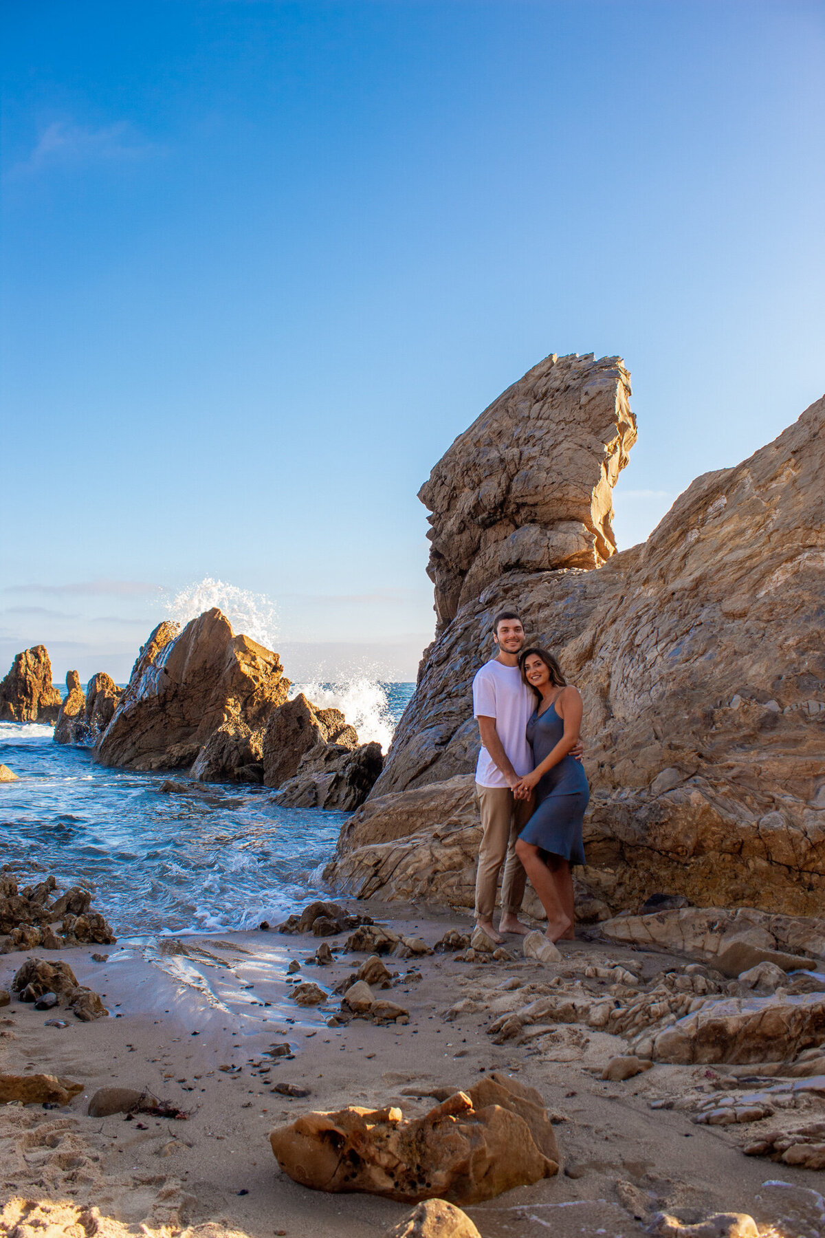 phoenix engaged couple pose at beach