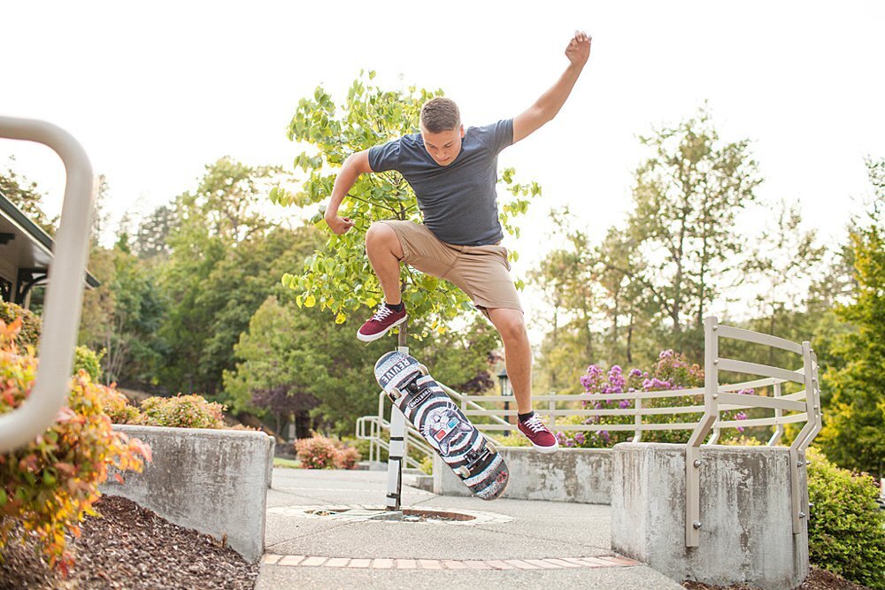 Senior guy doing skateboard jump trick
