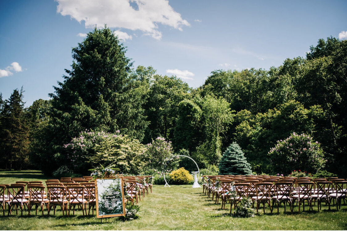 Beautiful Boston scenic woods wedding with arch florals by Prose Florals