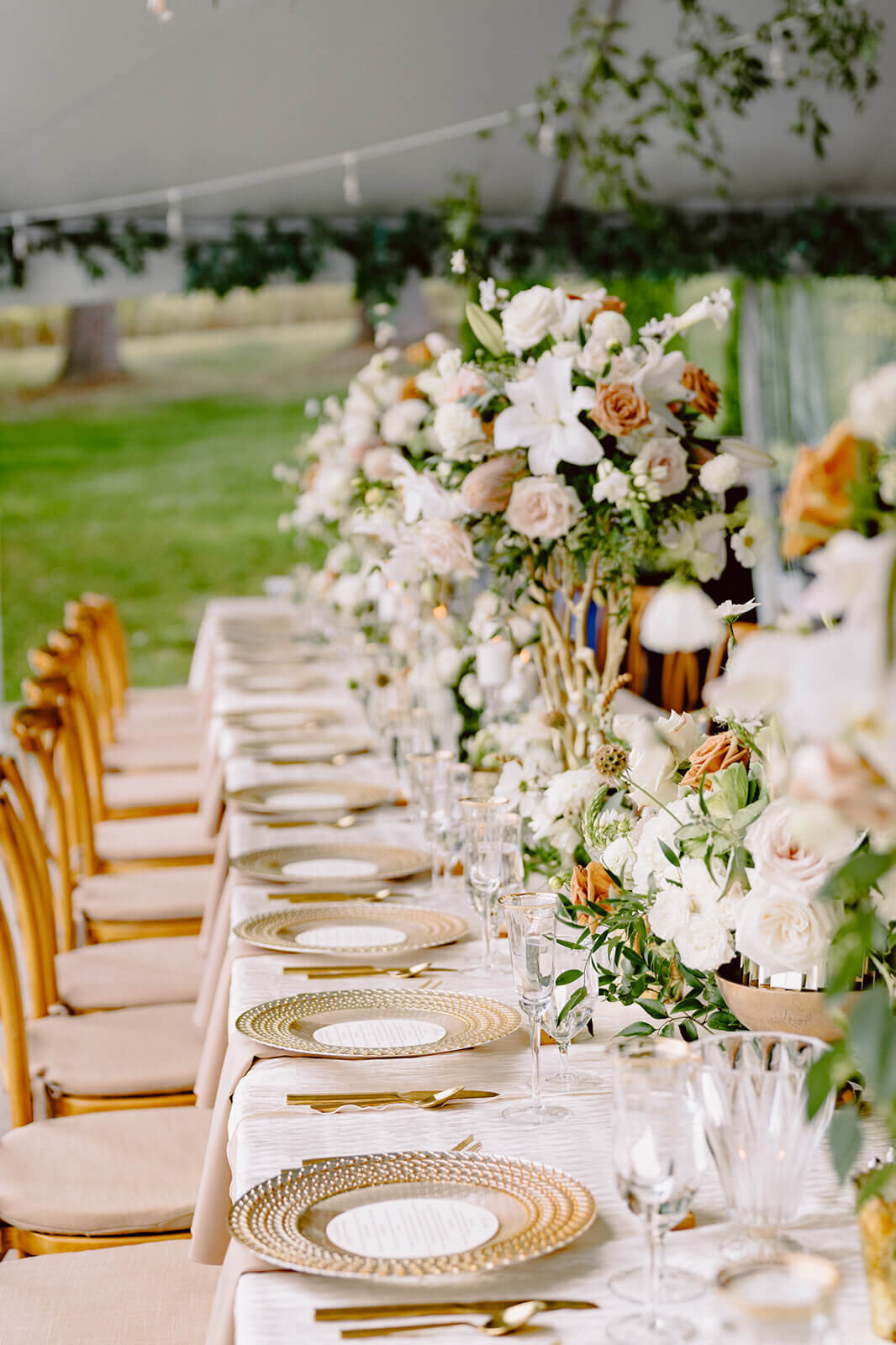 Wedding reception tables with florals, glasses and plates at Finger Lakes Wedding, New York