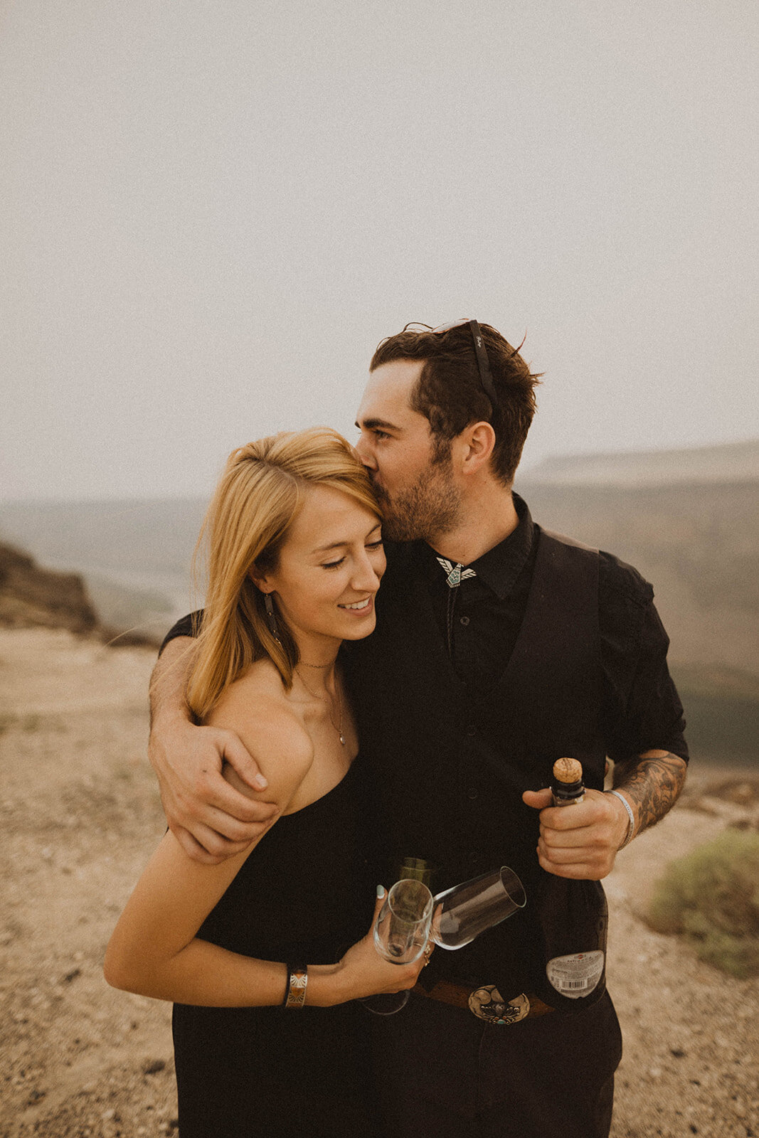 guests hug each other as they watch their friends' elopement ceremony in idaho