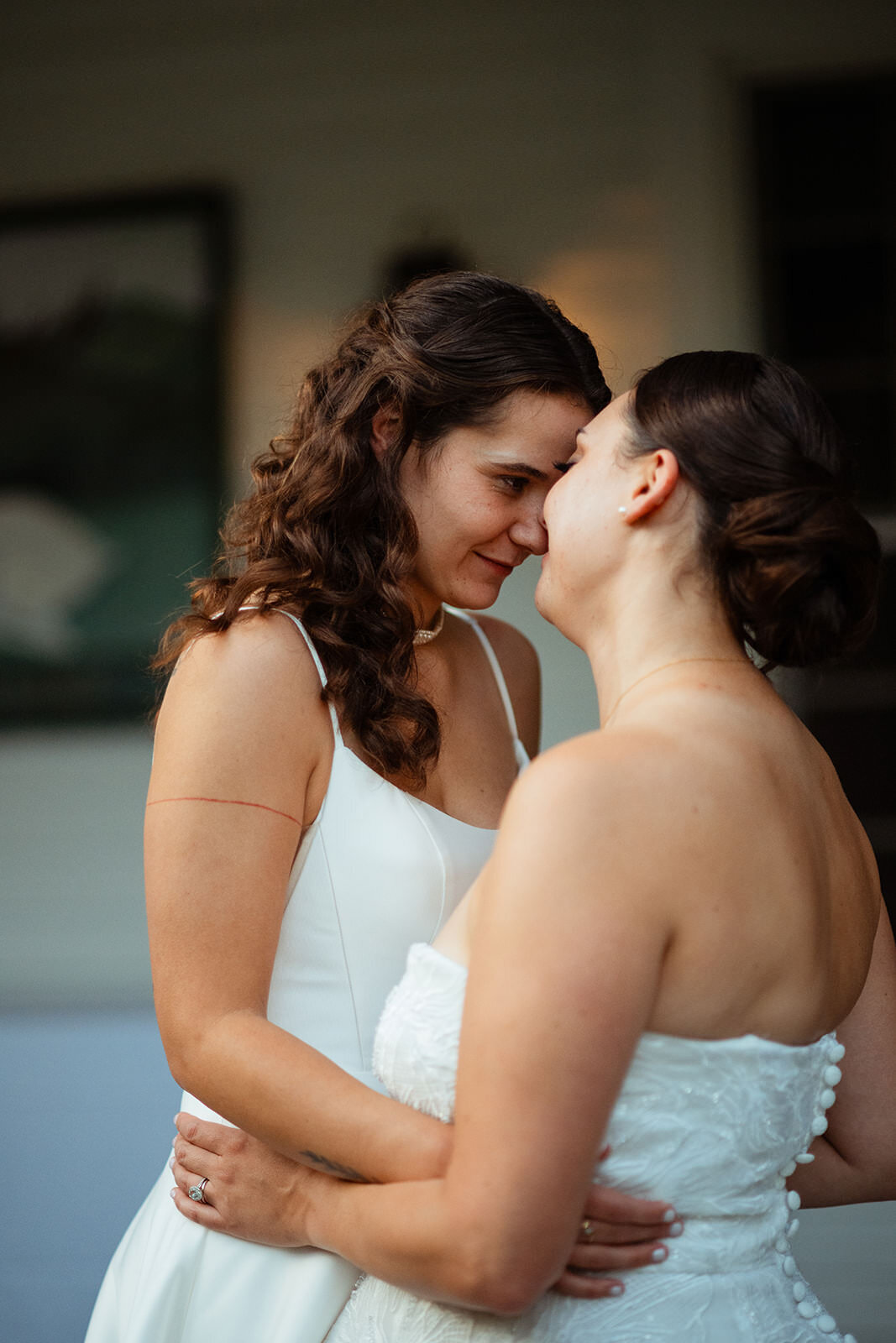 Brides leaning their foreheads together