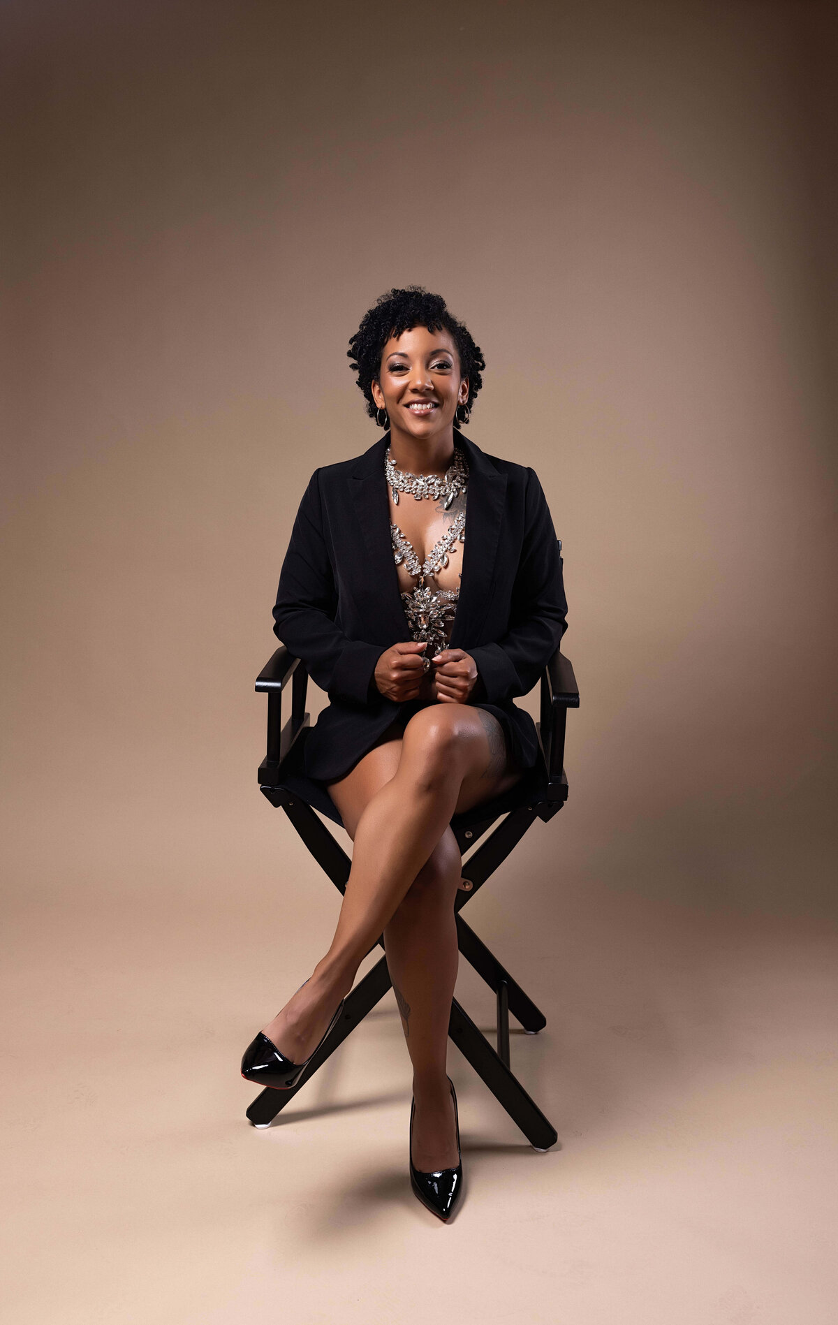 Woman sitting in chair for birthday session with Reva Davis photography