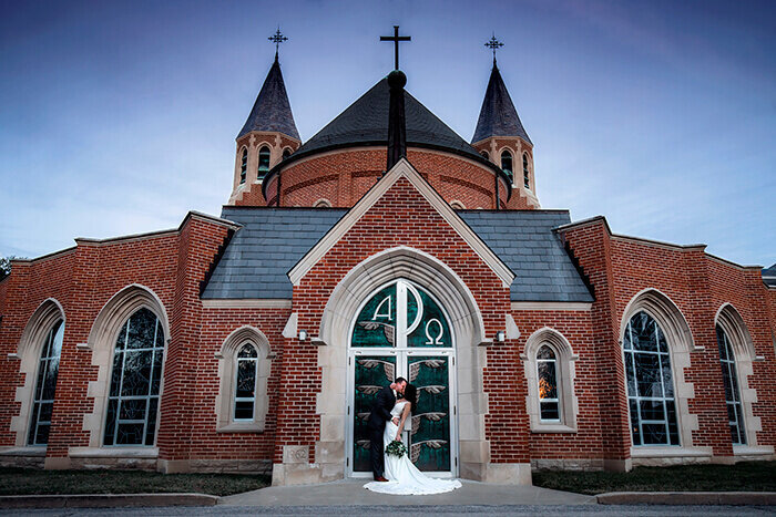 groom-dips-bride-teal-door-church