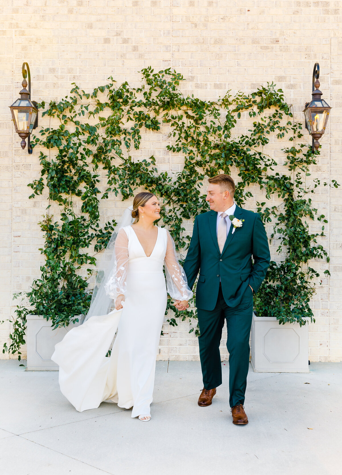 climbing jasmine wall with couple in front