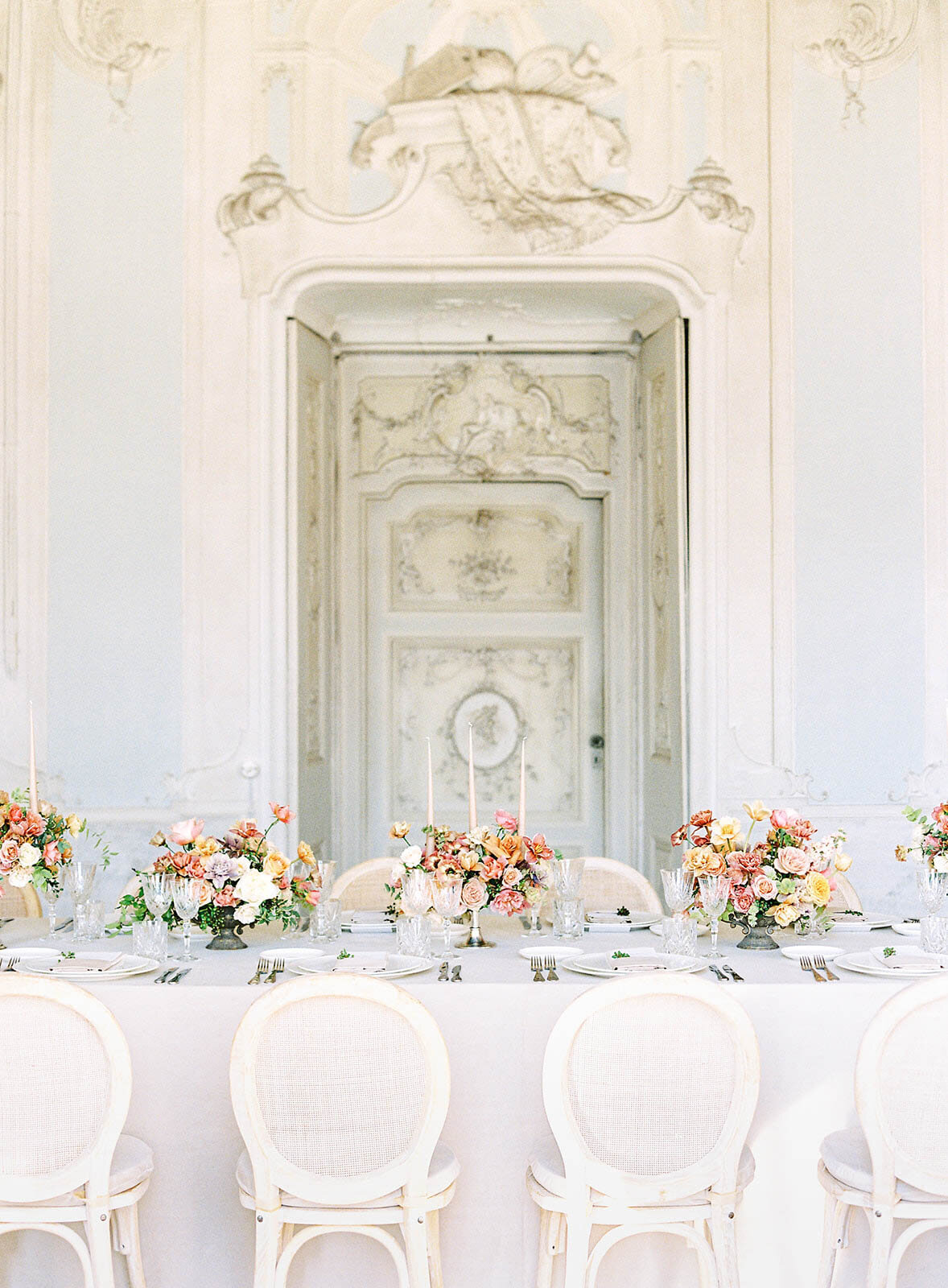 Wedding reception table in stucco room of Villa Sola Cabiati on Lake Como photographed by Italy Wedding photographer