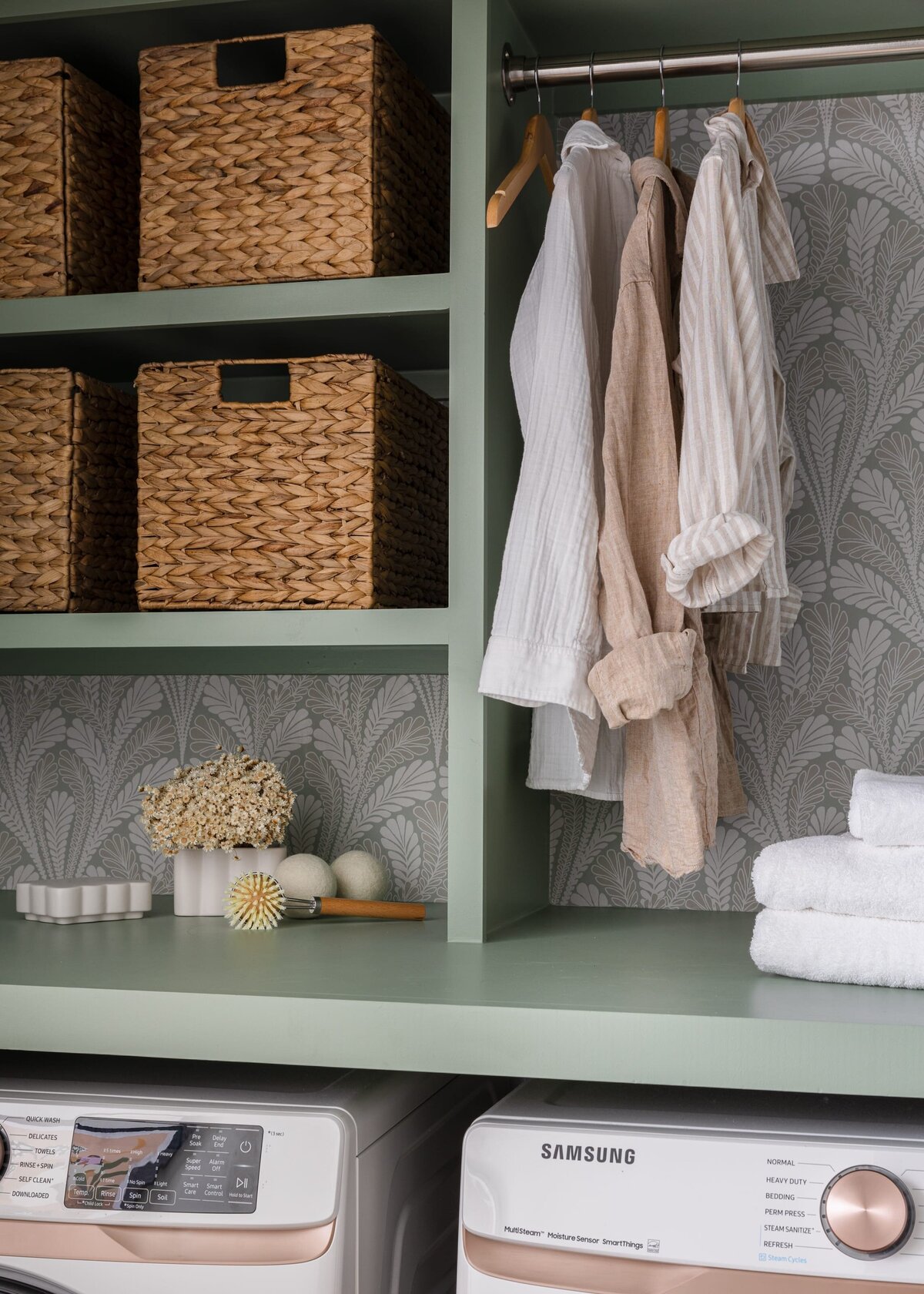 melinda chesson interiors murrayhill road sage green laundry room botanical wallpaper and hanging clothes